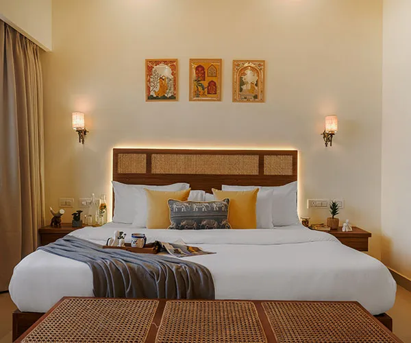 Bedroom with king bed and framed wall art at Manovan Resort
