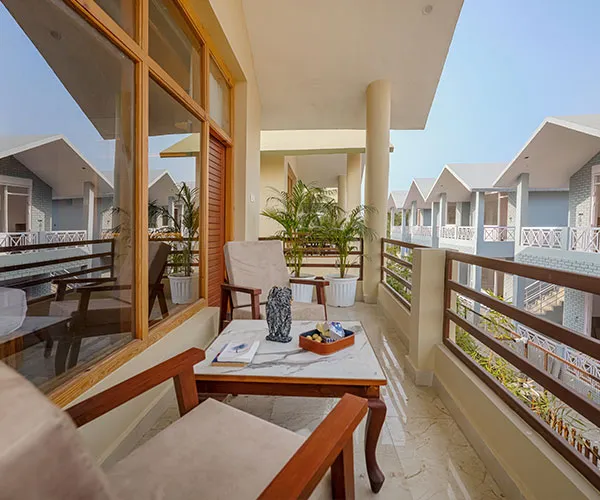 Balcony seating overlooking the cottages - Manovan Resort