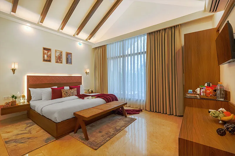 Bedroom with wood beam ceiling at Manovan Resort