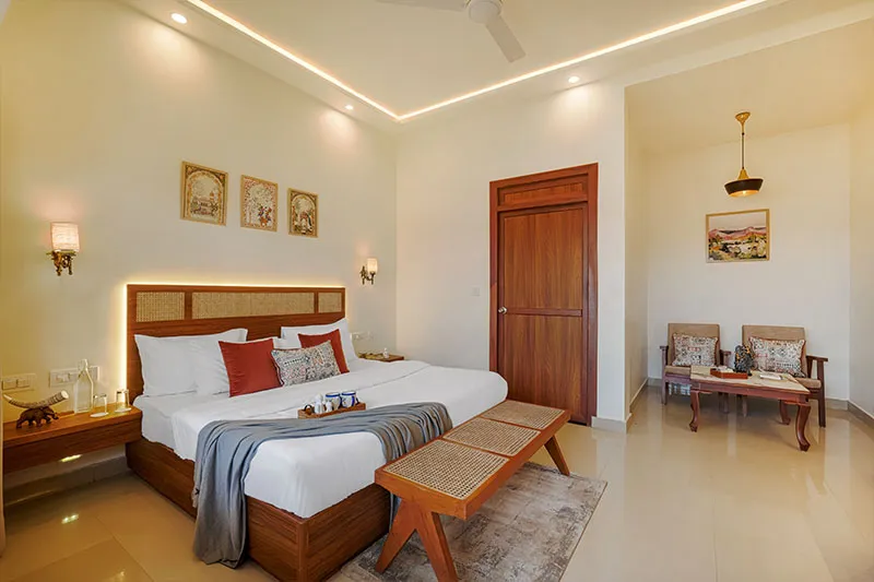 Bedroom with bench seating and marble flooring at Manovan Resort
