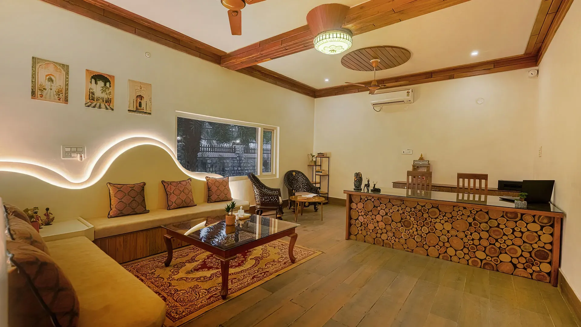 Cozy lounge interior with wooden beam ceiling at Manovan Resort