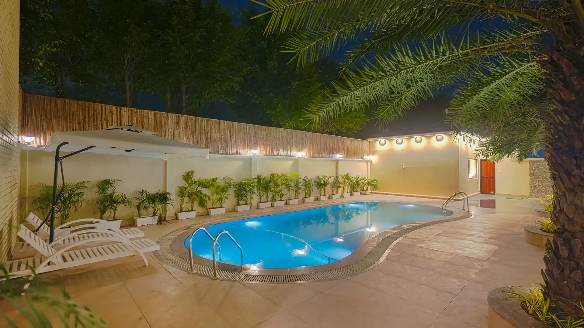 Manovan Resort swimming pool illuminated at night