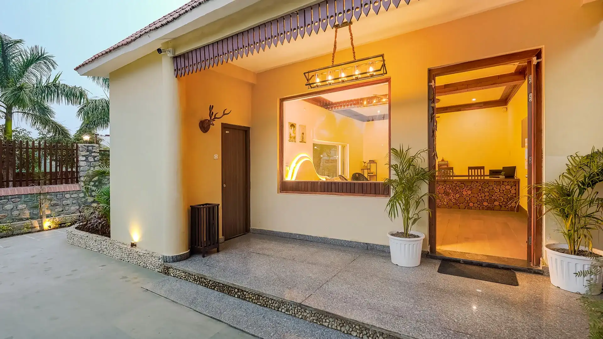 Manovan Resort entrance porch and reception at dusk